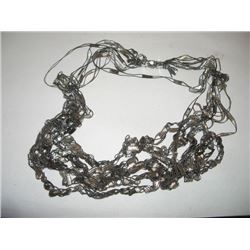 Beautiful hand-knitted long black and white necklace