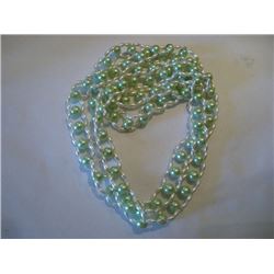 Long beaded strand green and white necklace