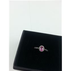 LADIES DEEP PINK TOPAZ AND DIAMOND SOLITAIRE RING. OVAL CUT. NICELY DETAILED