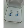 Image 2 : PAIR OF 14KT WHITE GOLD DANGLING NATURAL BLUE TOPAZ AND DIAMOND SET EARRINGS. THE PAIR HAS 2 TOPAZ,