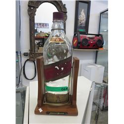 Vintage Johnny Walker bottle on stand