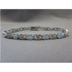 6 CTW Blue Topaz & Diamond tennis bracelet