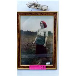 Framed print of a female field worker