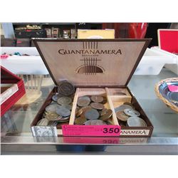 Cigar box of assorted tokens