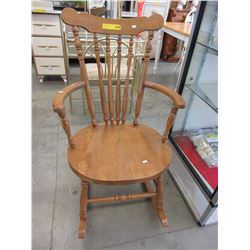 Oak rocking chair with spindle back