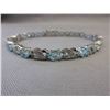 Image 1 : Blue Topaz & Diamond tennis bracelet