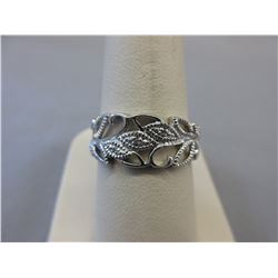 Diamond studded filigree swirl ring