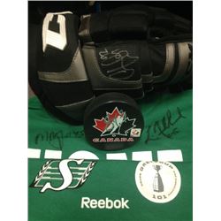 Saskatchewan Roughrider T-shirt signed by Luc Mullinder and Mike McCullough.   Hockey glove signed b