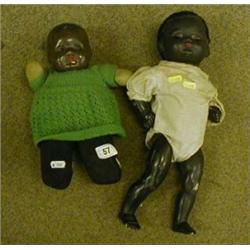 Two black dolls. £20-30...