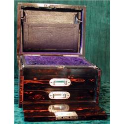 A Victorian coromandel lady's jewellery/vanity box with hinged lid enclosing mirror and interior...