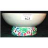 A Clarice Cliff Newport pottery bowl, the base frieze decorated with flowers (light hairline cra...