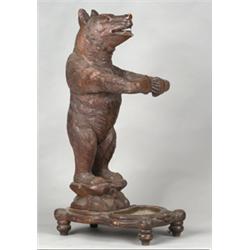 Late 19th Century/early 20th Century Black Forest stickstand in the form of a standing bear with...