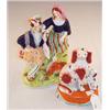 Image 1 : 19th Century Staffordshire flat back decorated with two figures with a bird and a dog, 24cm high...