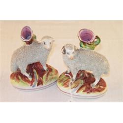 Pair of 19th Century Staffordshire spill vases formed as a ram and a ewe having grog decorated bo...