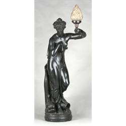 19th Century black glazed terracotta figure of a classical maiden standing beside a dolphin, conv...