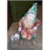 Image 1 : Late 19th/early 20th Century terracotta garden gnome, the bearded figure seated on a tree trunk a...