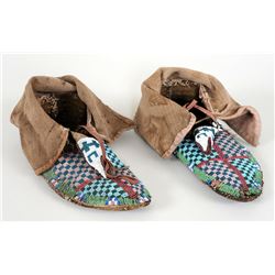 Pair of 19TH C. Beaded High Top Moccasins with Geometric Design and Parfleche Soles 9 3/4" L.  Fair 