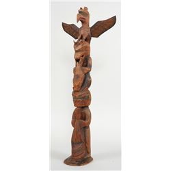 Early Charlie James Totem Carved with Thunderbird, Sea Bear Splitting a Seal and Bear Holding a Scul