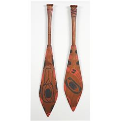 Pair of Tlingit Dance Paddles with Painted Design ca. 1920  19 1/2" L and 20 3/4" L. Both 3 3/4" W. 