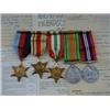Image 1 : A SERIES OF FIVE WWII MEDALS, ribbons on bar, 39-45 star, Africa Star, Italy Star, Defence medal...