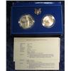 Image 1 : 51. 1986 S Statue of Liberty Two-Piece Unc Set with Silver Dollar and Half-Dollar.