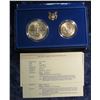 Image 2 : 51. 1986 S Statue of Liberty Two-Piece Unc Set with Silver Dollar and Half-Dollar.