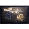 Image 1 : 172. 1973 S Eisenhower Uncirculated Silver Dollar in original cellophane and blue envelope with lite