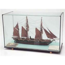 A scale model of the tall ship 'Alabama' mounted in a glass case with modellers label, illustrati...