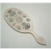 Image 1 : An early Victorian ivory hand mirror with heraldic engraving, engraved overall with a Ducal crown...
