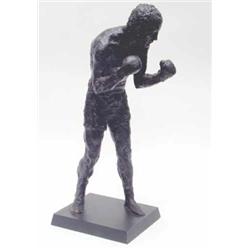 A bronzed resin figure of Henry Cooper by Dr Gainsborough, standing boxing with arms up on rectan...