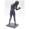 Image 1 : A bronzed resin figure of Henry Cooper by Dr Gainsborough, standing boxing with arms up on rectan...