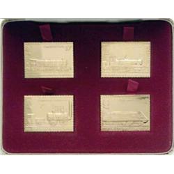 A set of four silver-gilt replica stamps commemorating 150 years of passenger railway....