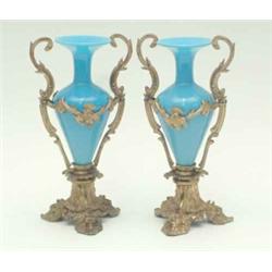 A pair of French mid 19th century gilt bronze and blue opaline glass vases, the mounts of rococo...