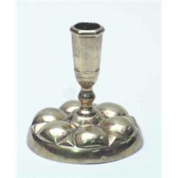 A late 17th century Flemish brass lantern candlestick, the squat stem on a circular base cast wit...