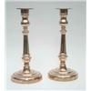 Image 1 : A pair of bell metal candlesticks of George III design, each with cylindrical stem and circular b...