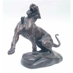 A French early 20th century bronze model of a cougar by Thomas Cartier, wounded by an arrow and r...