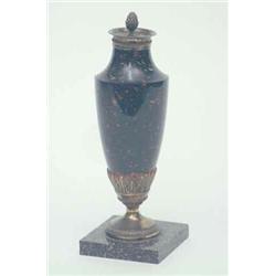 An early 19th century Russian (Kolyvan) porphyry marble urn, the tapering urn with acanthus clad...