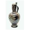 Image 1 : A large 19th century German brown-glazed porcelain ale jug, traditional form with 'long beard' cy...