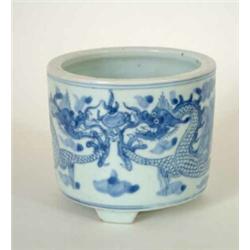 A 17th century blue and white tripod cylindrical censer, on short feet, painted with 2 four-clawe...