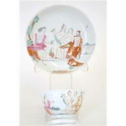 A Chien Lung famille rose 'Judgment of Paris' tea bowl, and saucer (chip and crack to bowl, chip...