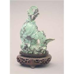 A large turquoise matrix snuff bottle, carved as an upright fish on wave base, 19th century, matc...