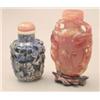 Image 1 : A sodalite oviform snuff bottle, relief carved with figures and prunus, 2.75ins; and a carnelian...