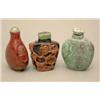 Image 1 : A dark chalcedony snuff bottle, carved in high relief using the reddish orange skin with flowerin...