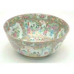 A late 19th century Cantonese enamel punch bowl, typically decorated with figural and botanical p...