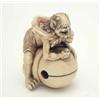Image 1 : An ivory study of Oni, Meiji, open-mouthed character seated astride mokugyo bell, signed, 1.5ins...