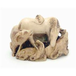An ivory study of wild animals, Meiji, boar, dog, shishi, bear, leopard, goat and rabbit encircli...
