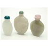 Image 1 : A Chinese celadon jade snuff bottle, modelled with irises, 2.5ins, another of plain flattened ovo...