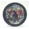 Image 1 : A Moorcroft bowl, painted with Orchids against a dark blue ground, painted initials and impressed...