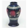 Image 1 : A Moorcroft Fruit and Berries baluster jar, early post-war, the continuous horizontal design pain...