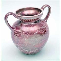 A William De Morgan two-handled vase, ovoid with twin loop handles, painted in ruby lustre with l...